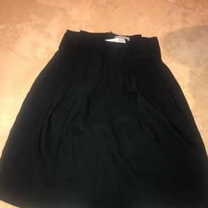 A cute black skirt with tags on!